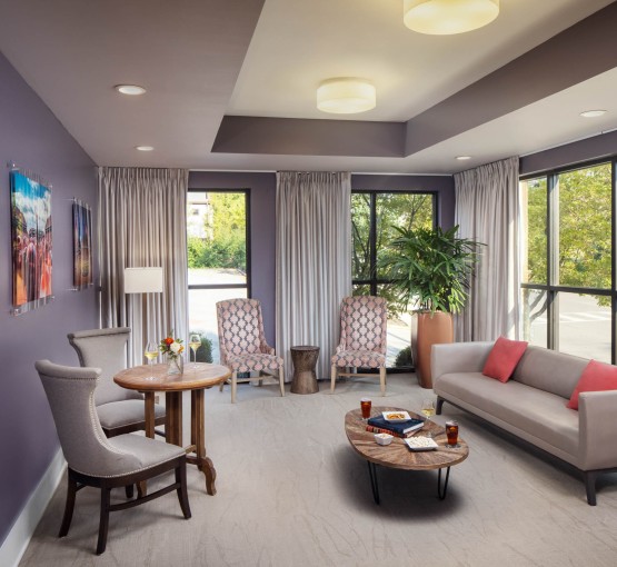 a room with a couch and chairs gallery