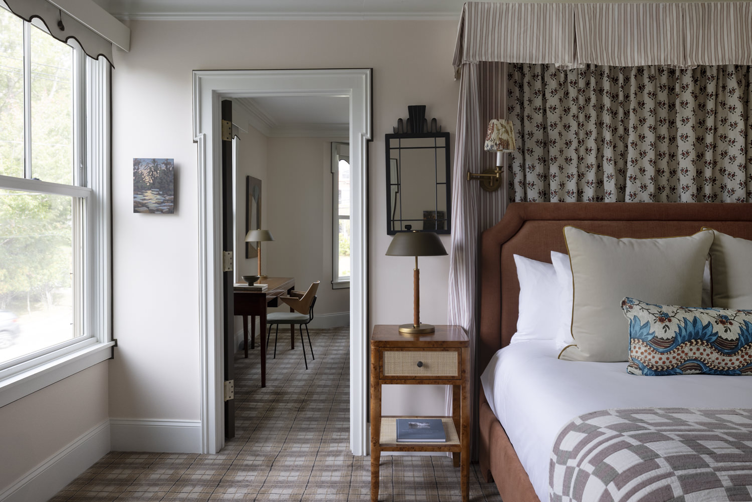 a bedroom with a bed and a table