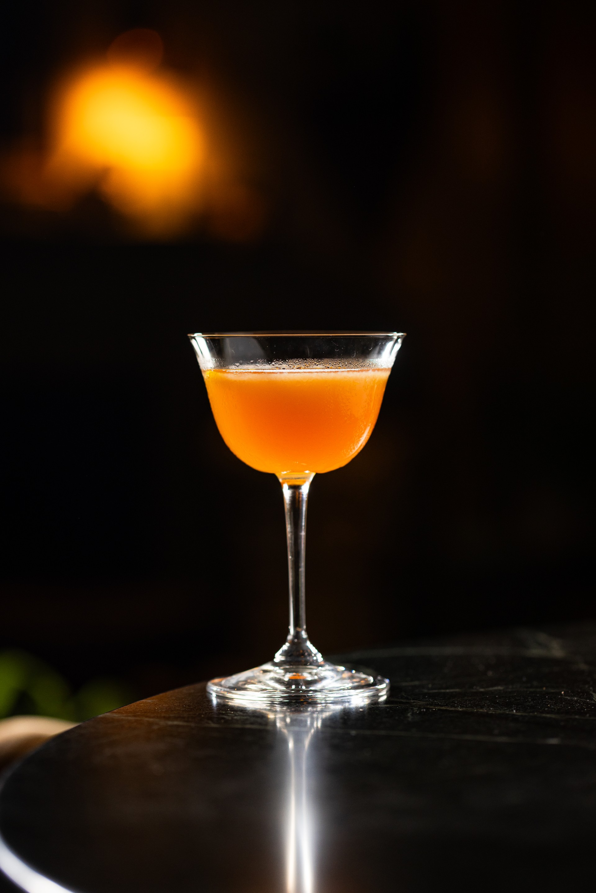 a glass of orange liquid