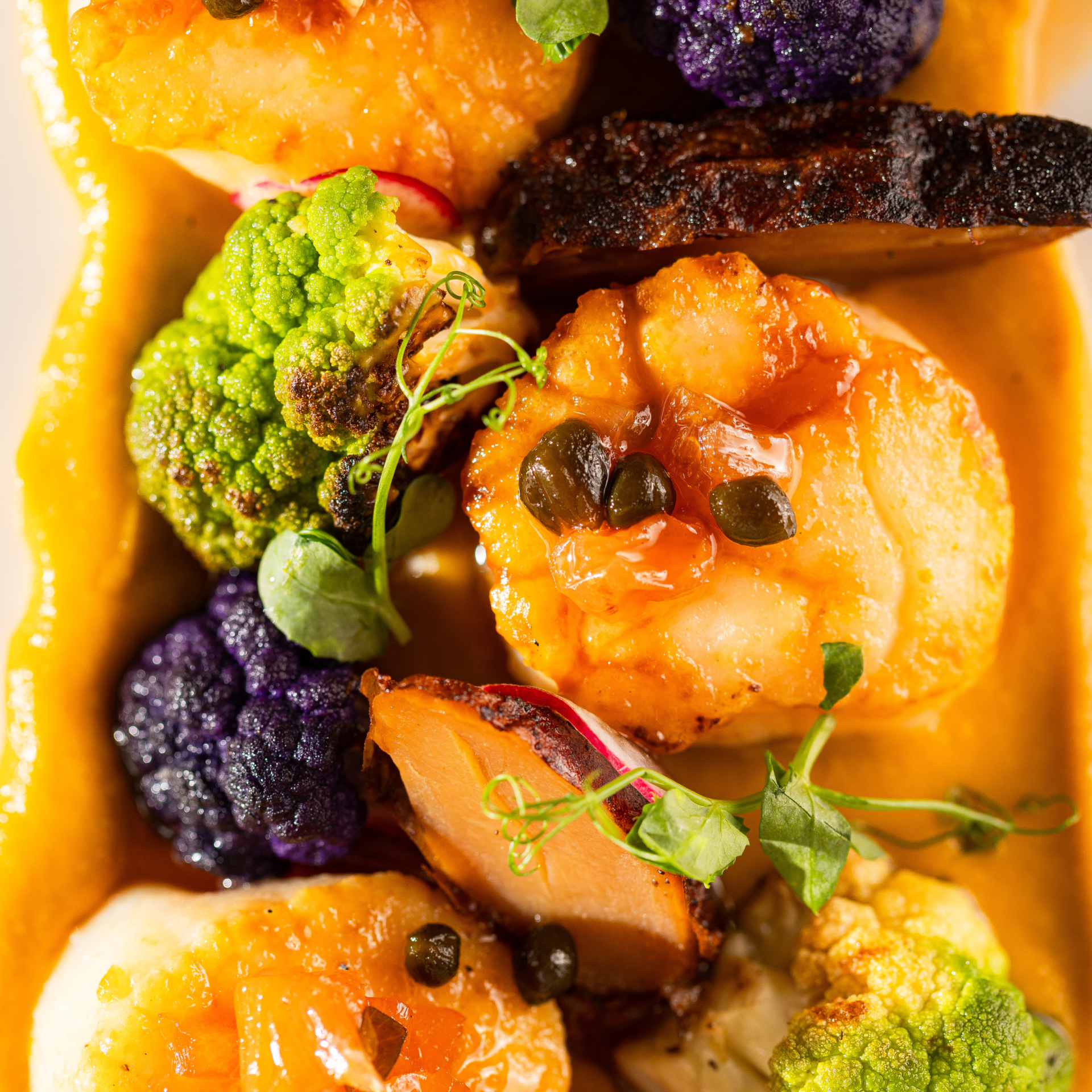 a plate of food with different colored food