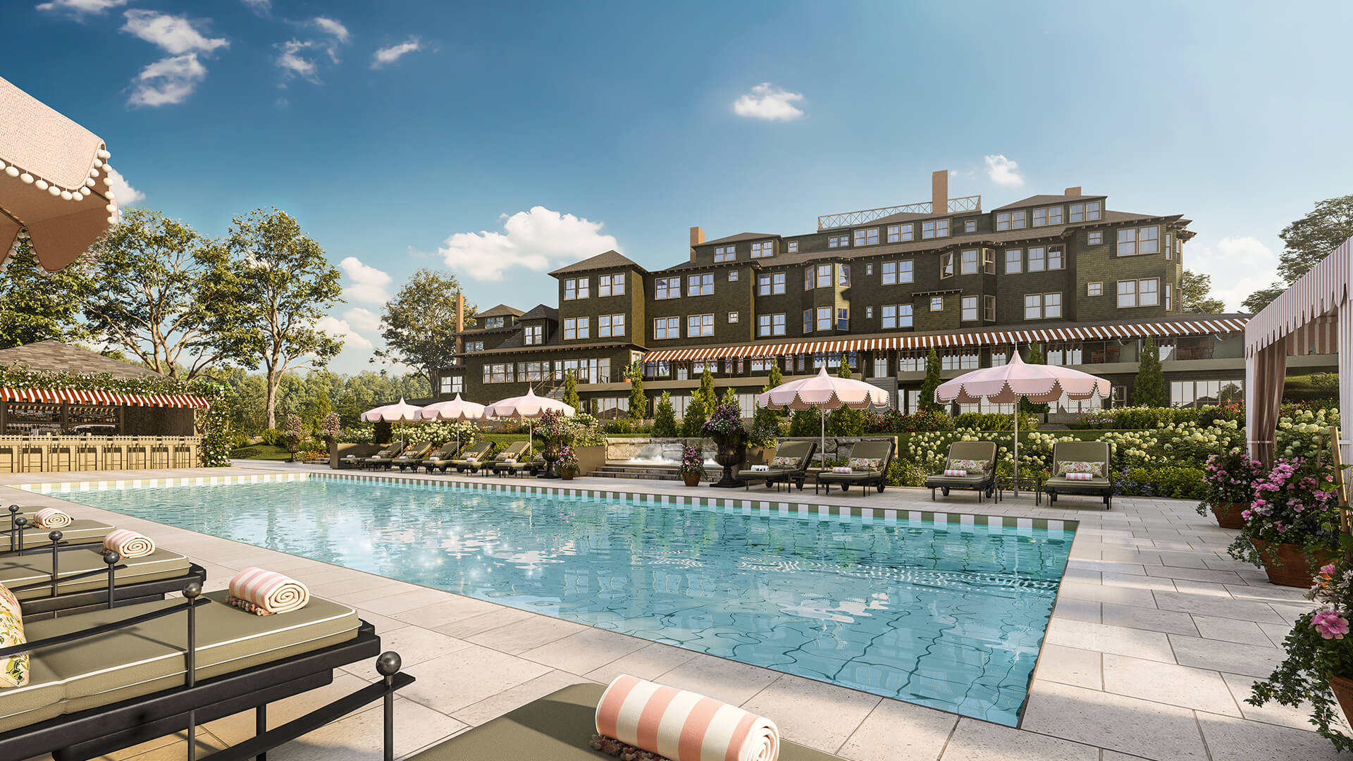 a pool with umbrellas and chairs in front of a building
