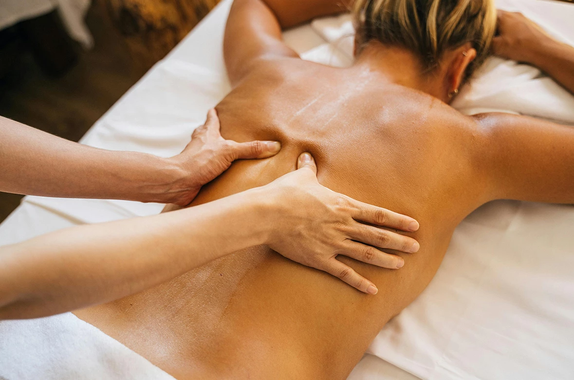 a person receiving a back massage
