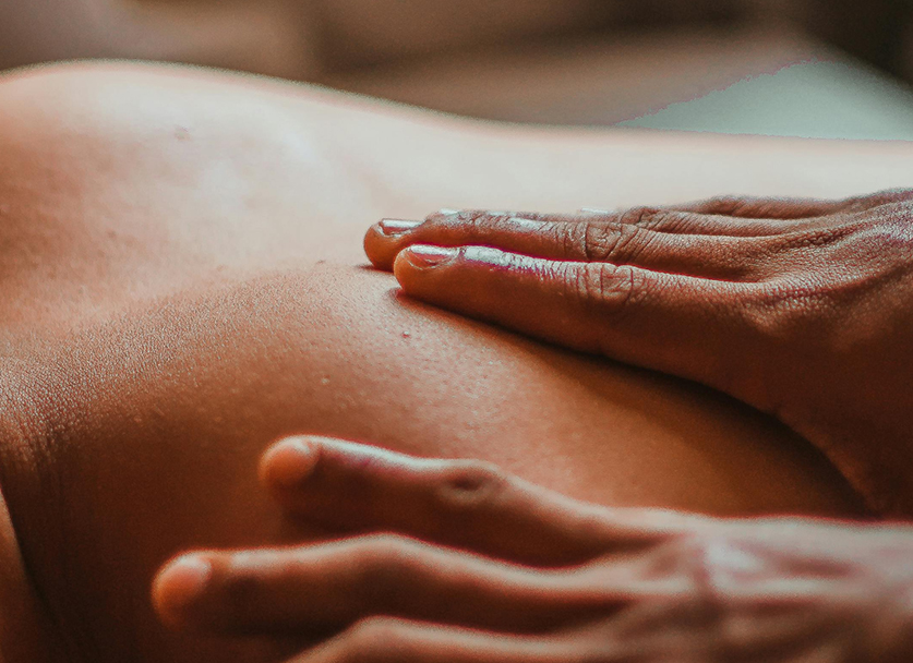 a person's hand on a person's back