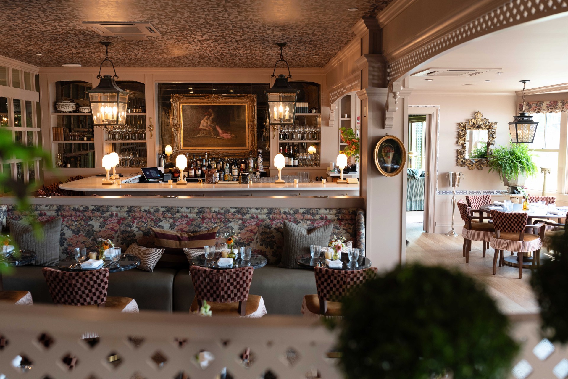 a restaurant with a bar and a painting