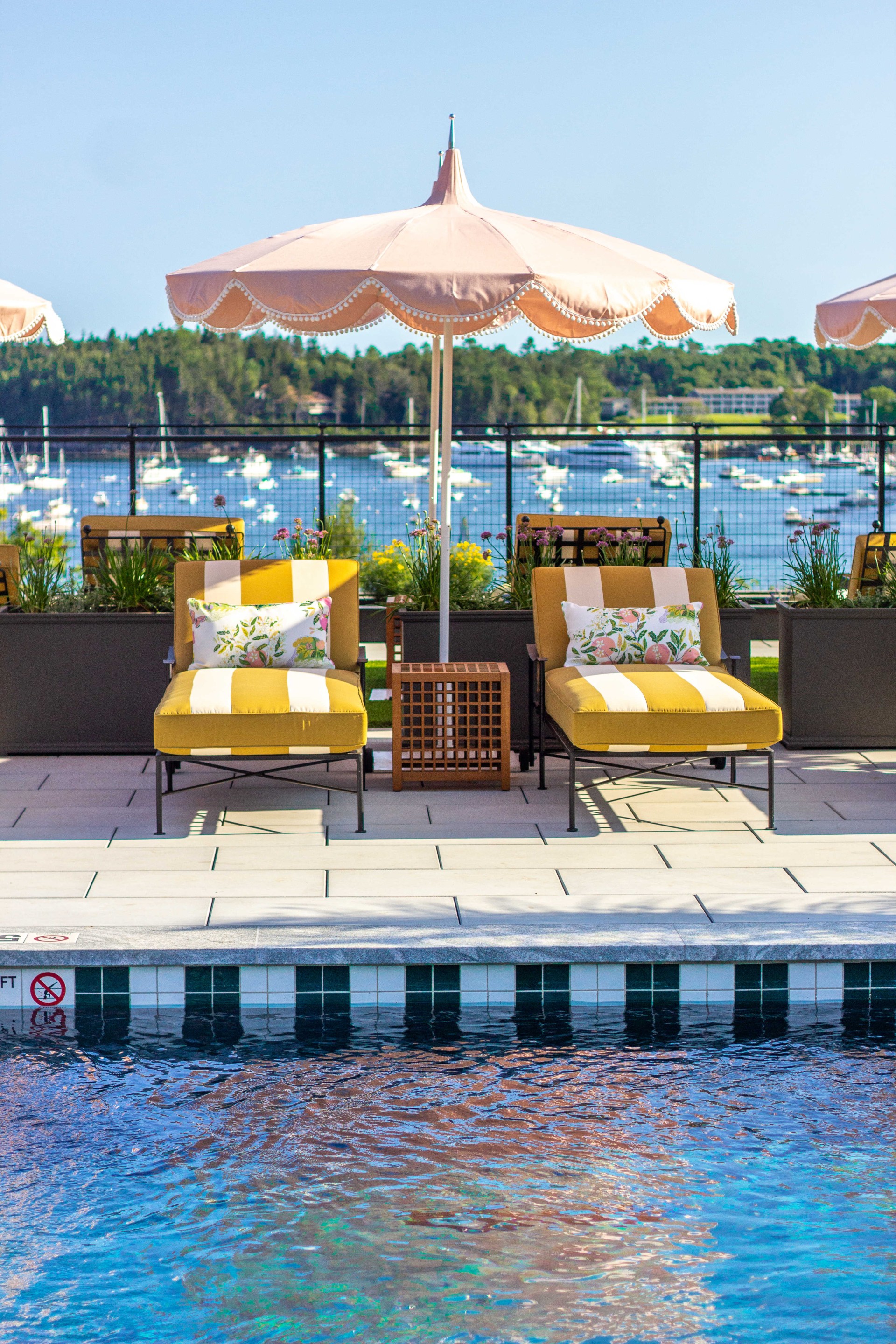 chairs and umbrellas by a pool