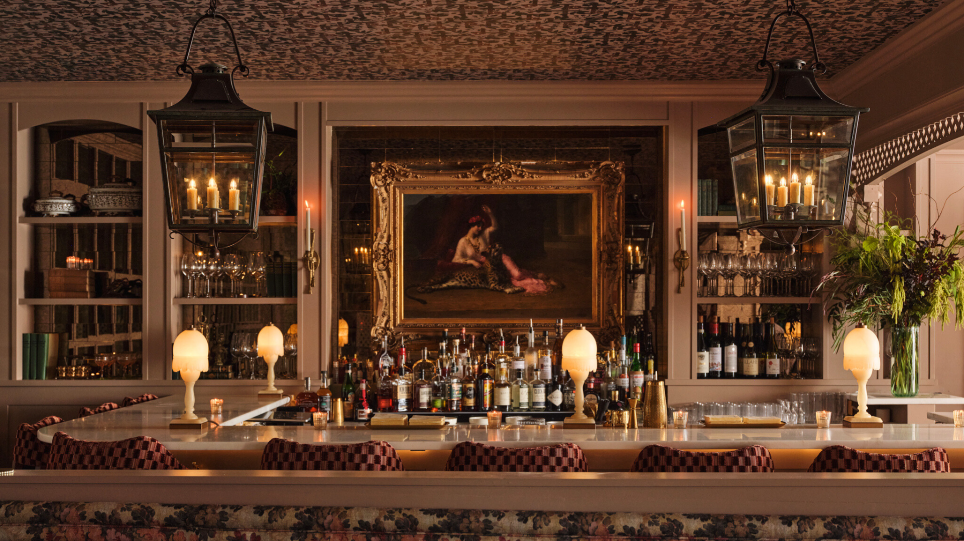 a bar with bottles and glasses
