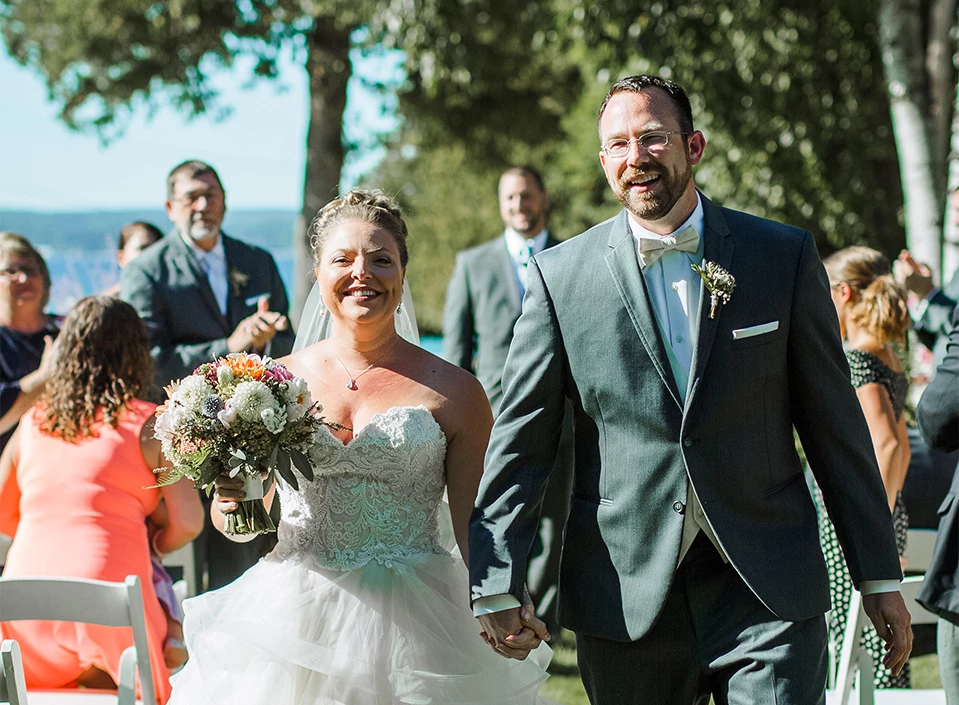 a man and woman walking down a path
