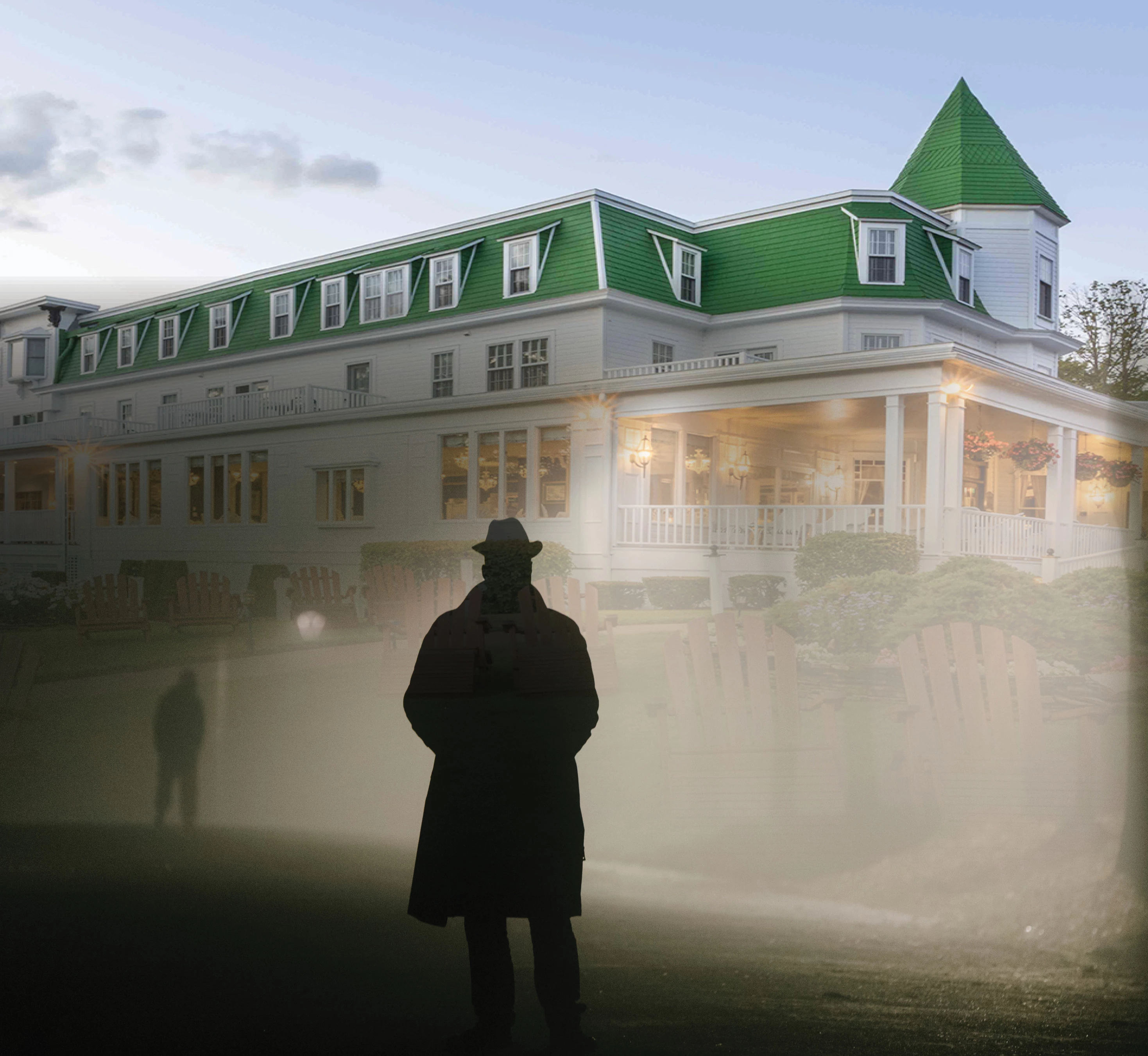 a man standing in front of a large building