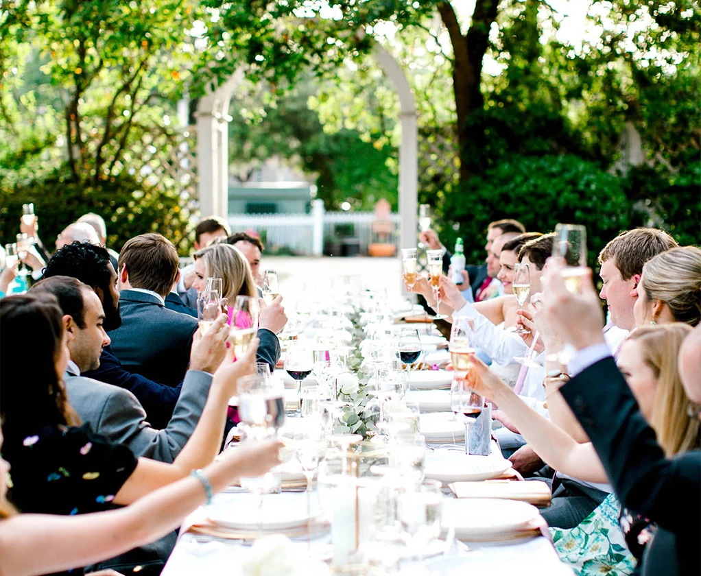 a group of people sitting at a table with drinks
