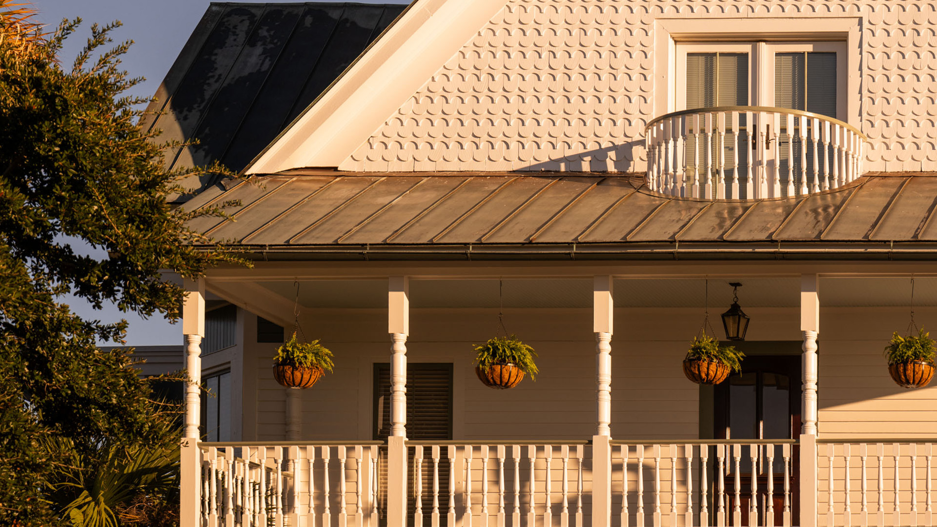 a porch with potted plants