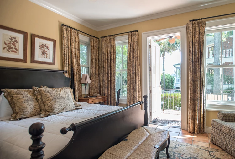 a bedroom with a bed and a bench