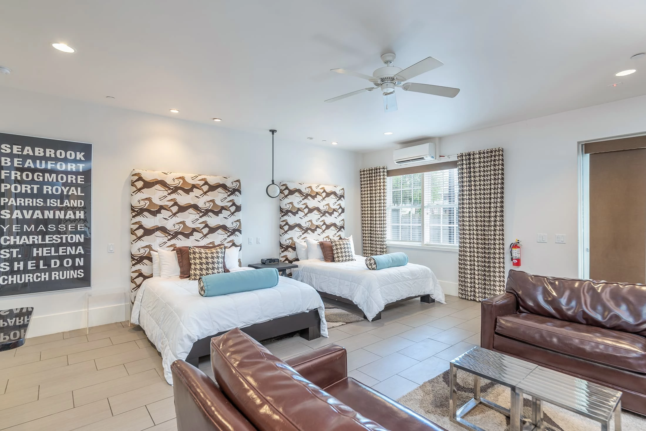 a room with two beds and a couch