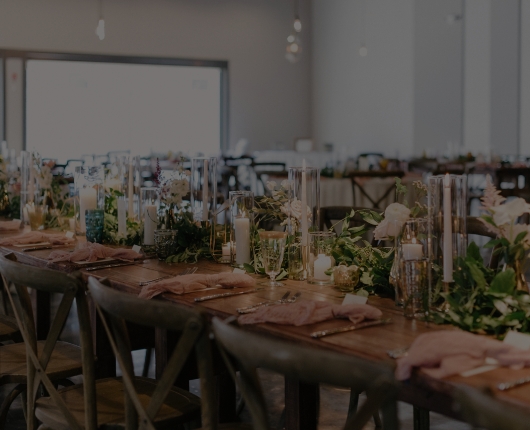 a long table with candles and flowers