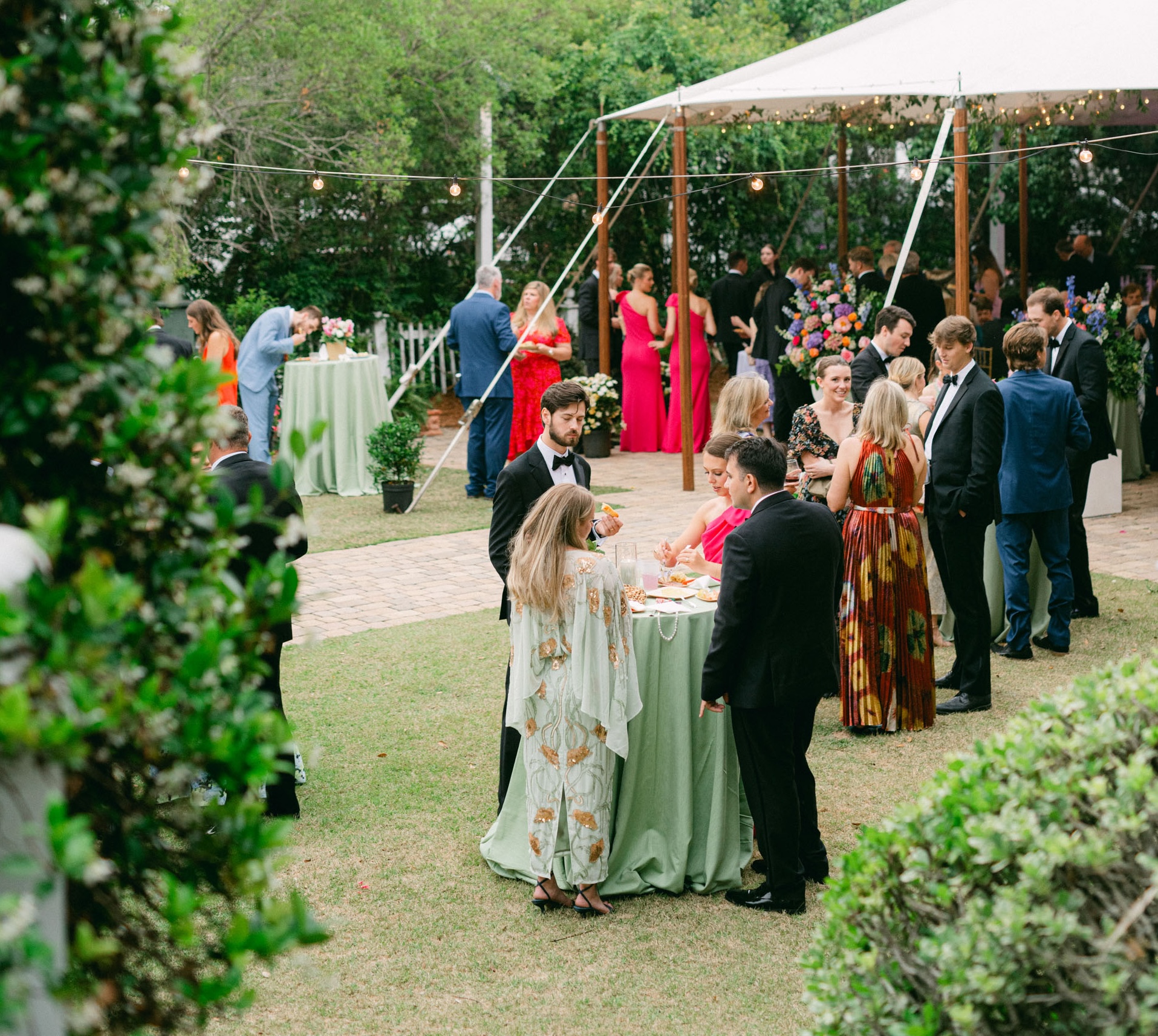 a group of people standing around a table