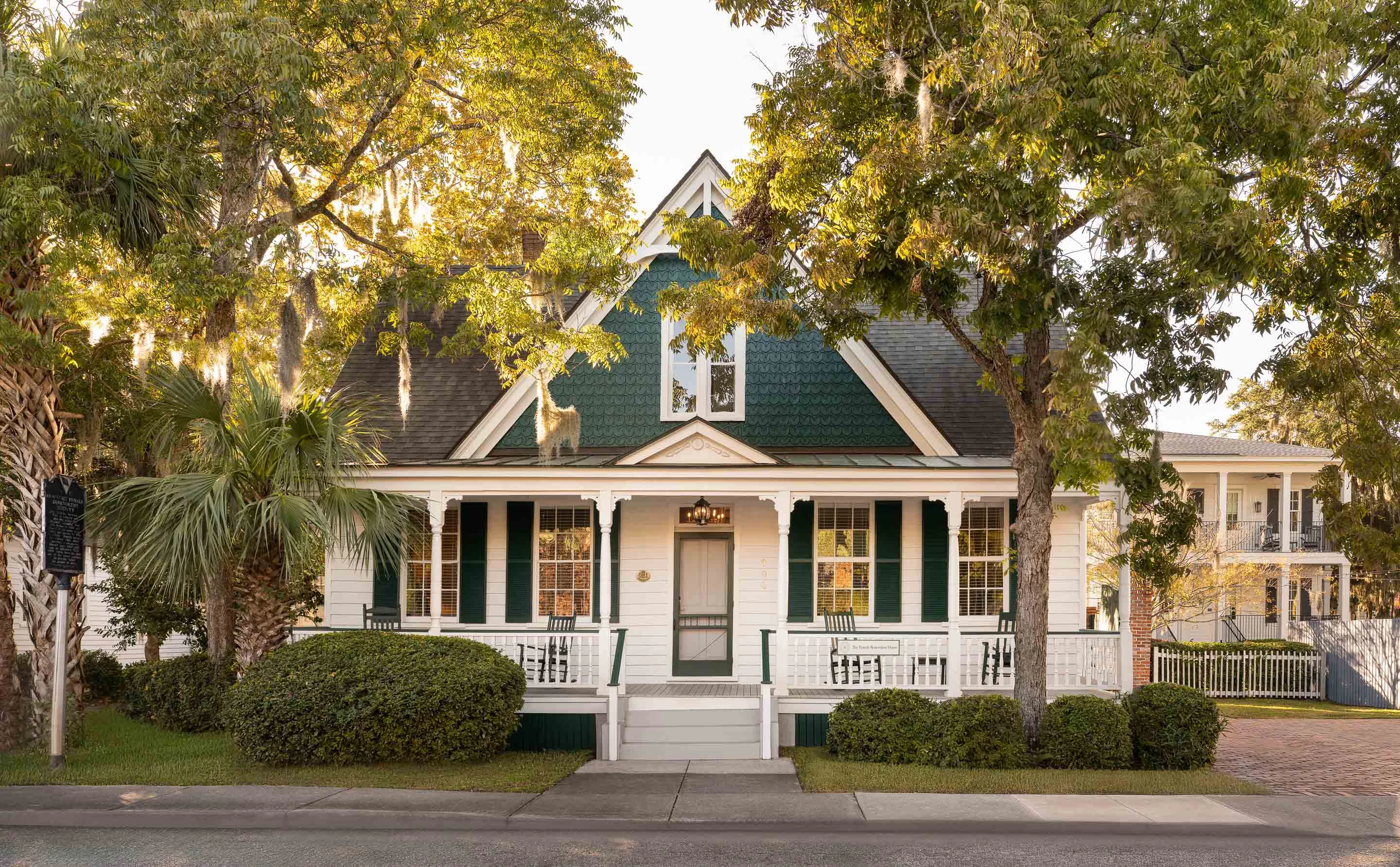 a house with trees and bushes