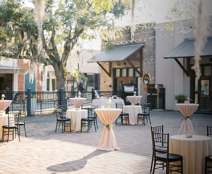 tables and chairs outside a building