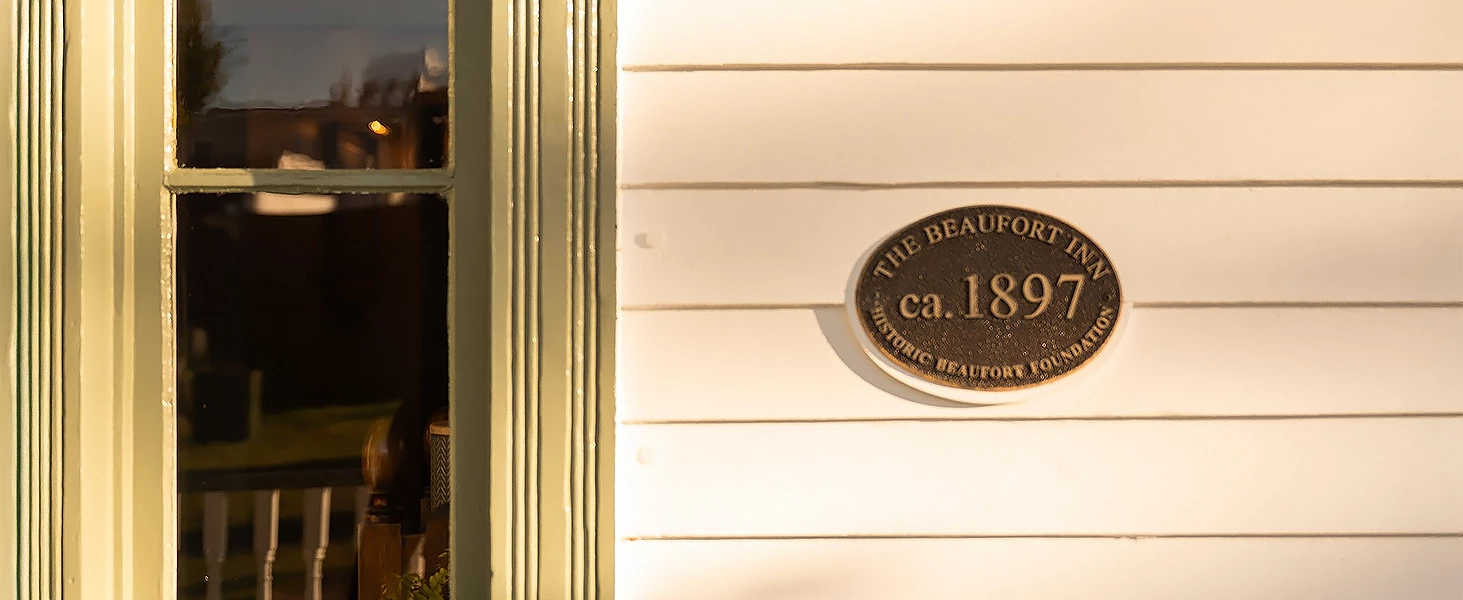 a sign on a white wall