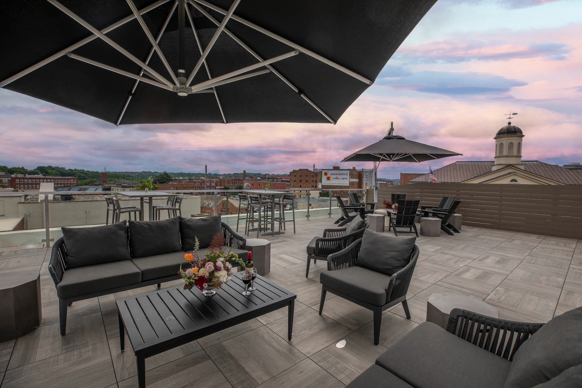a patio with chairs and umbrellas