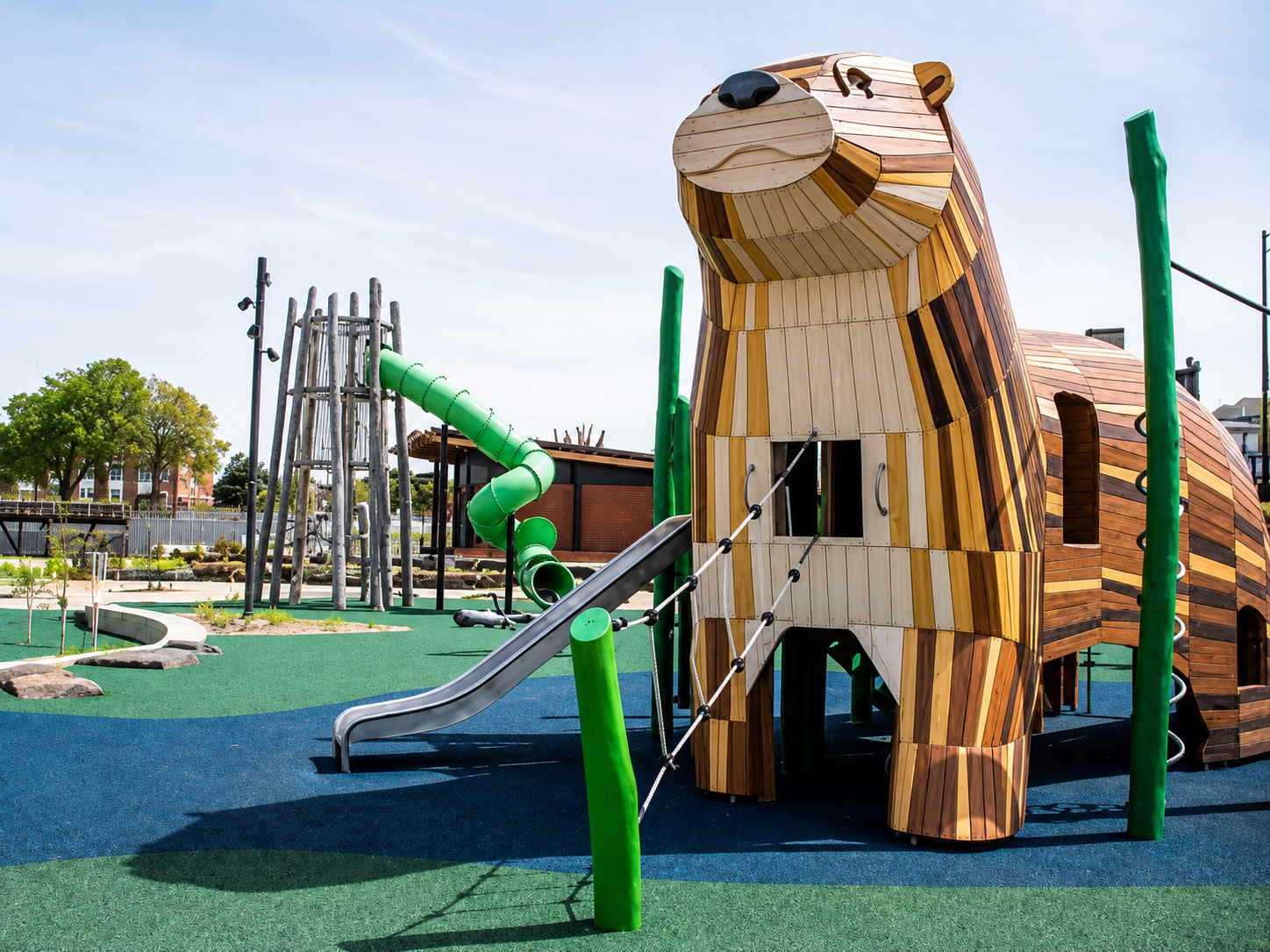 a wooden animal shaped object in a playground