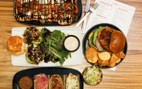 trays of different foods such as burgers and sandwiches
