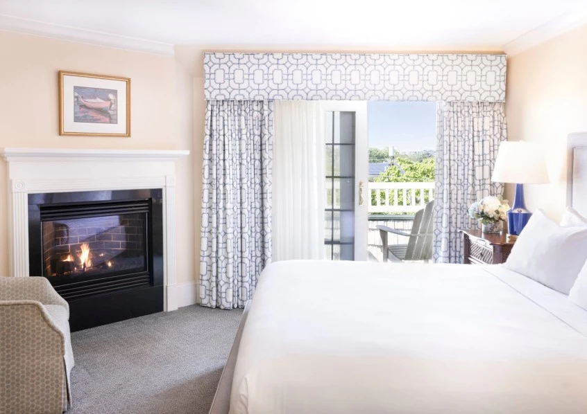 a room with a fireplace and a bed