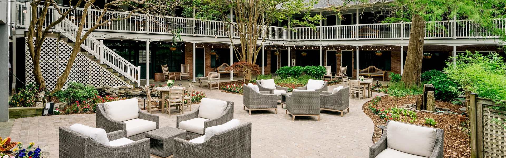 a patio with chairs and tables