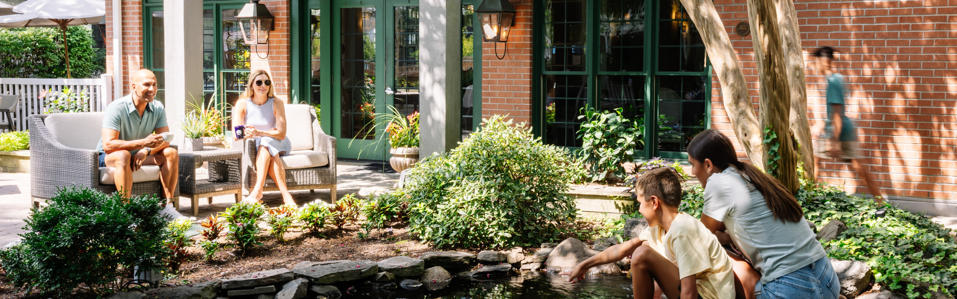 a person touching a pond