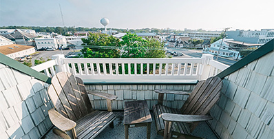 a deck with chairs and tables