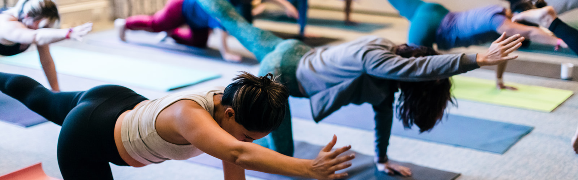 a woman stretching on a mat