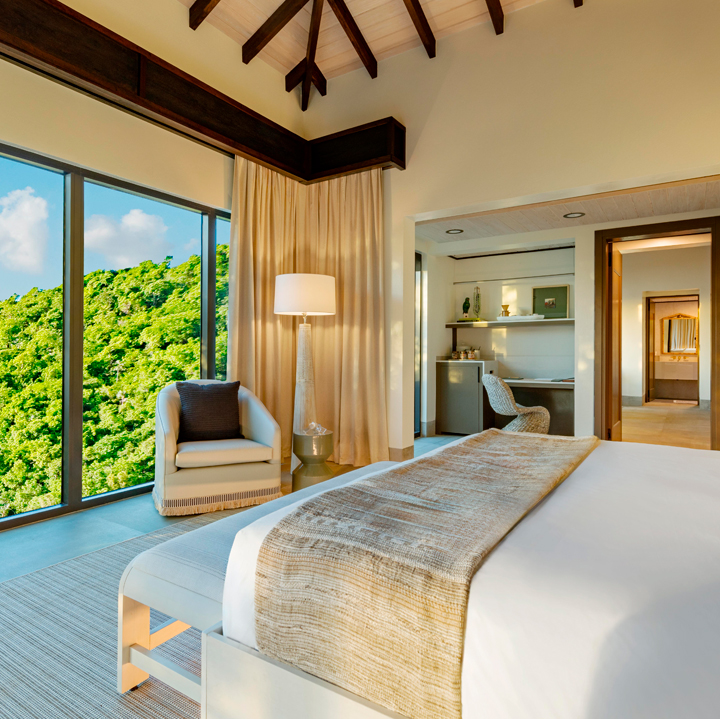 a bedroom with a large window