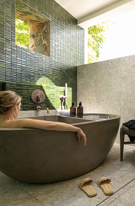 a woman sitting in a bathtub