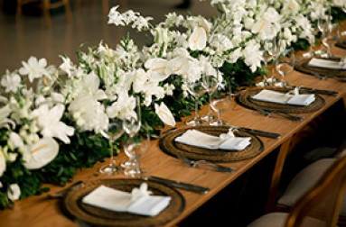 a long table with white flowers