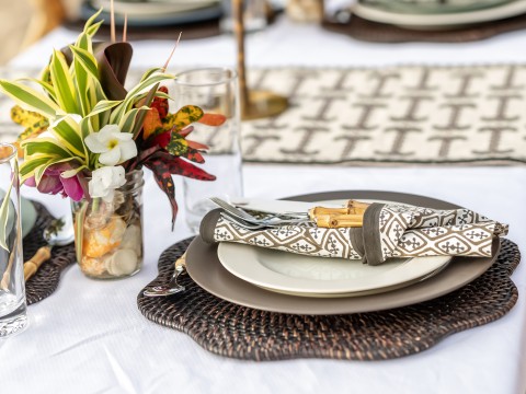 a table set with plates and silverware