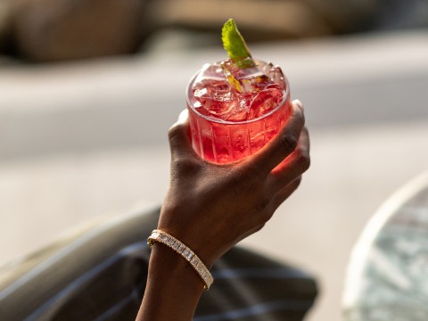 a hand holding a drink