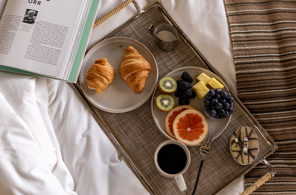a tray with food and a book on it