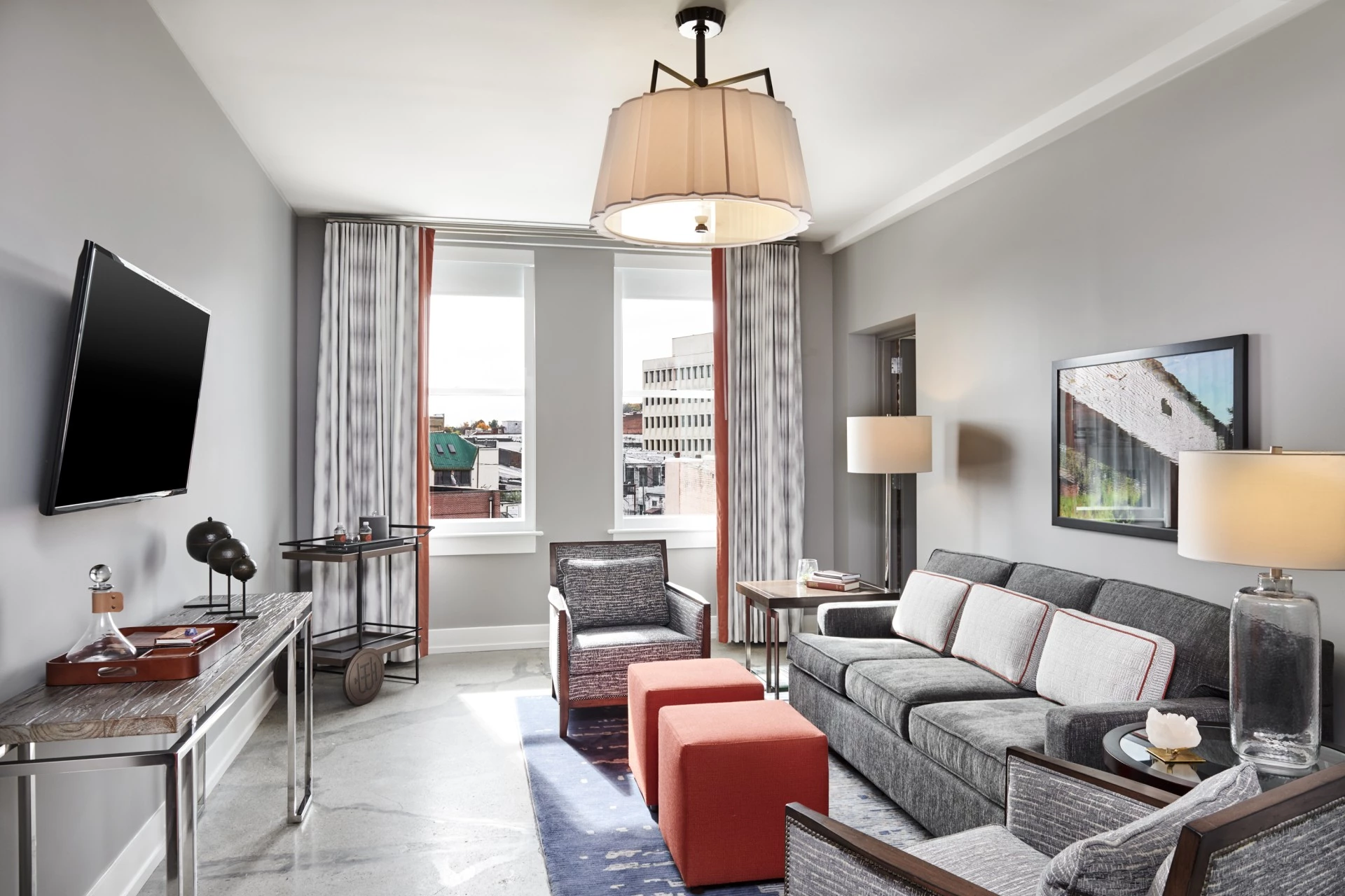 a living room with a couch and a lamp