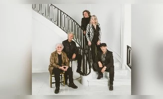 group of five people in a musician band