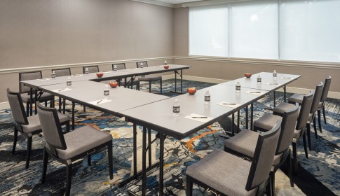 a room with tables and chairs