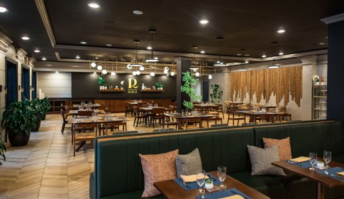 a restaurant with tables and chairs