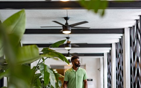 a man walking in a hallway