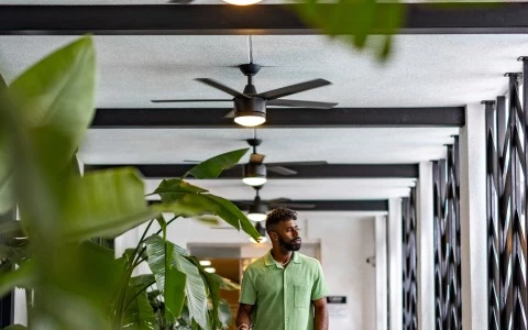a man walking in a hallway