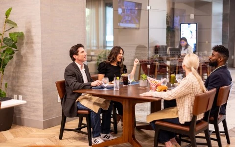a group of people sitting at a table