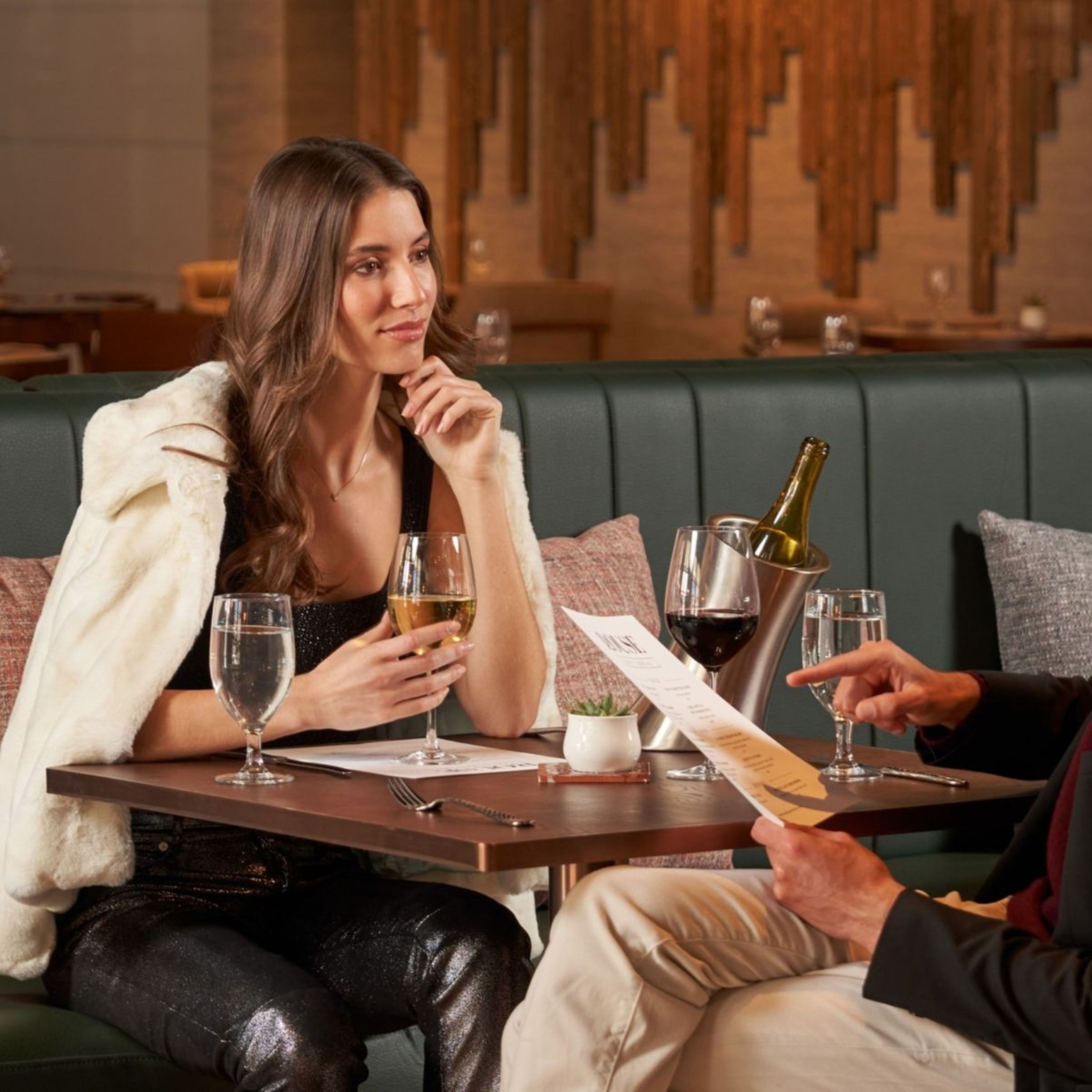 a group of people holding wine glasses
