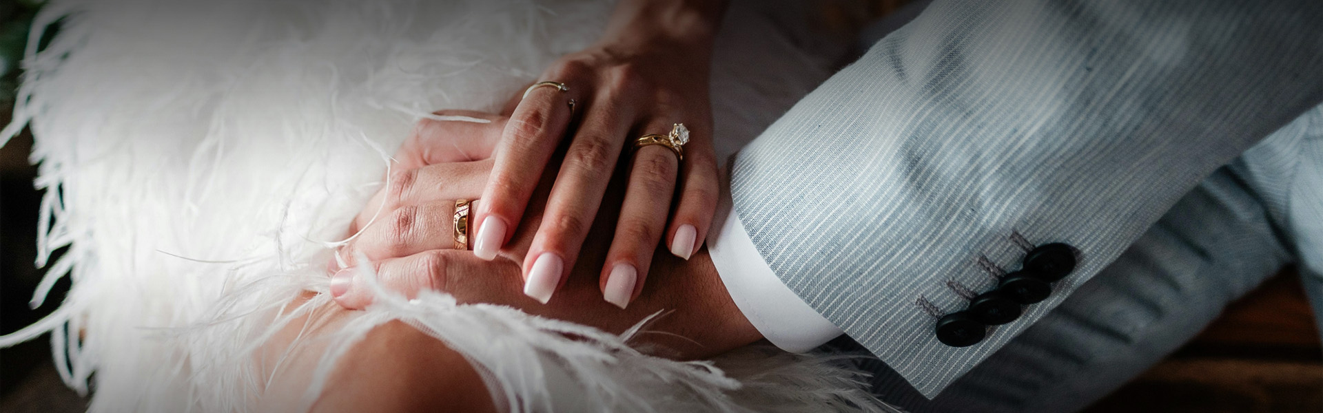 a close up of hands with rings on