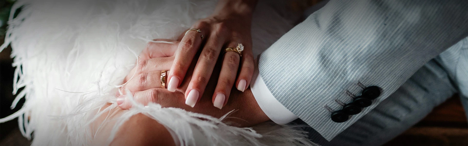 a close up of hands with rings on