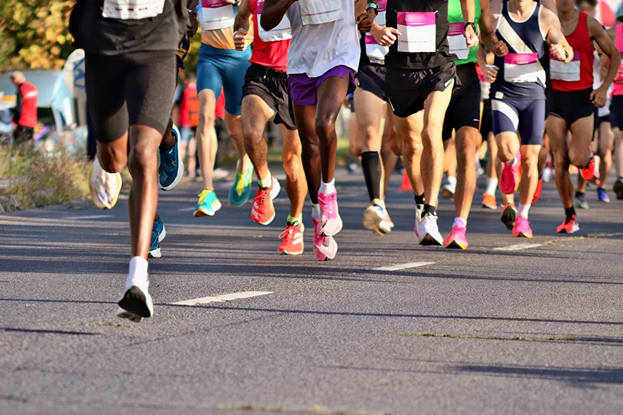 a group of people running on a road