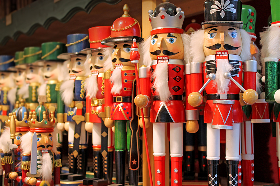 a group of nutcrackers on a shelf