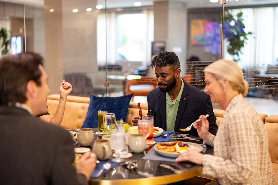 a group of people eating at a table