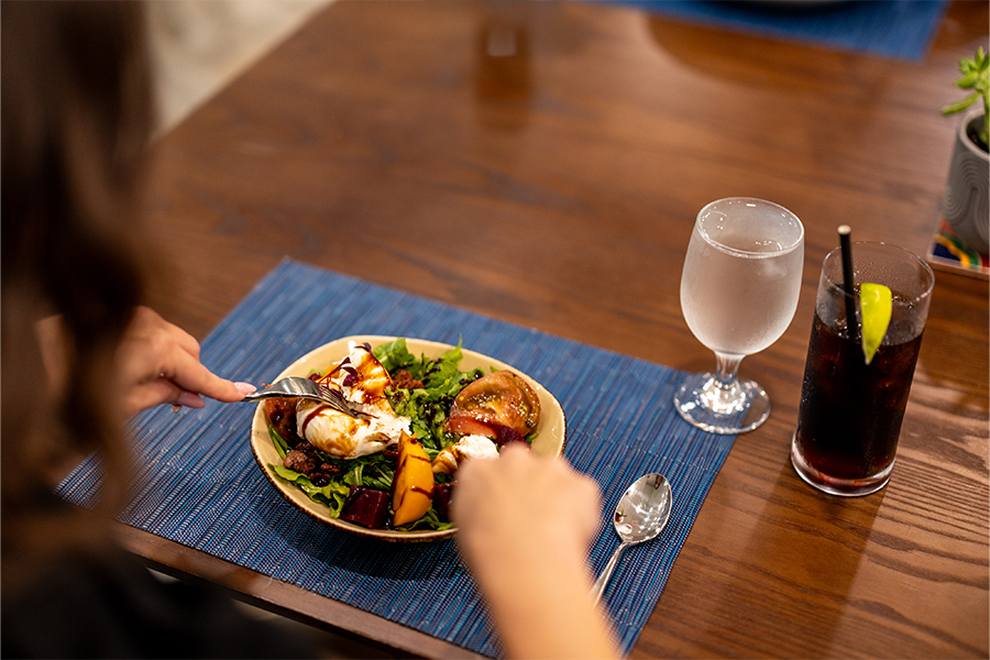 a person eating a salad