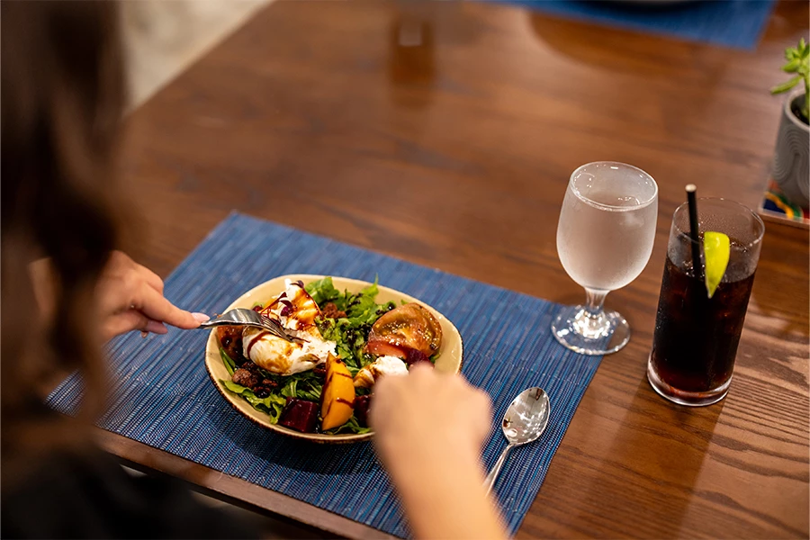 a person eating a salad